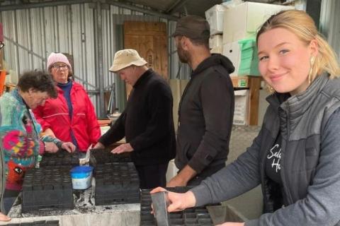 group of volunteers working in the nursery