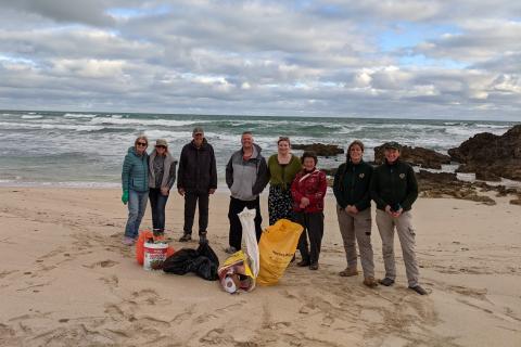 group of volunteers by the beach