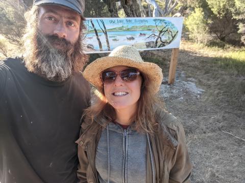 volunteers by the sign