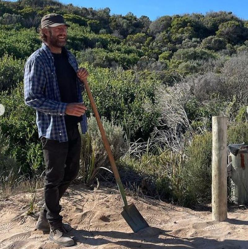 Roland fixing a post