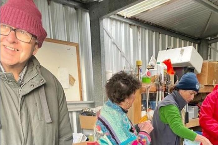 group of volunteers working in the shed