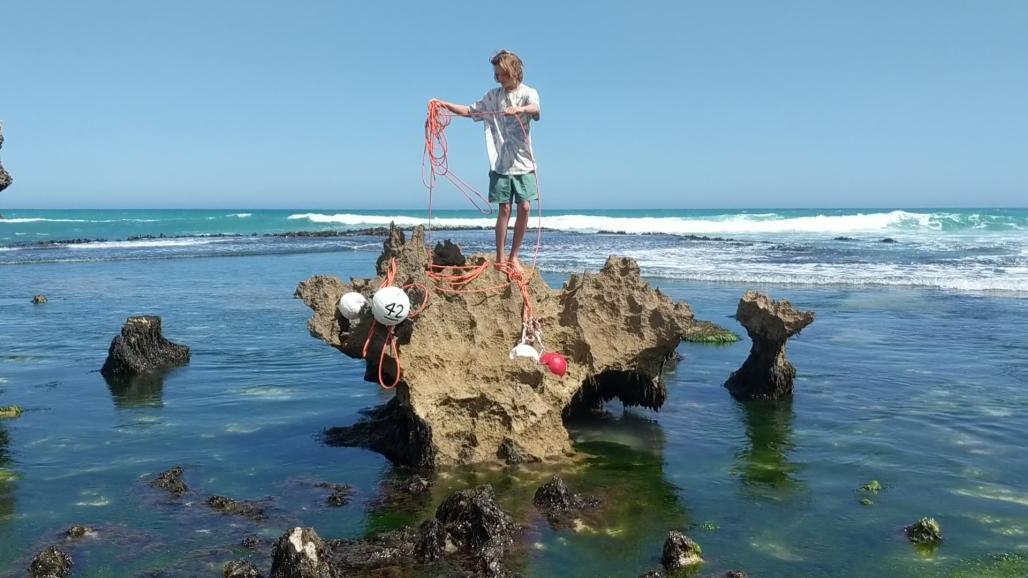 teen untangling fishing ropes