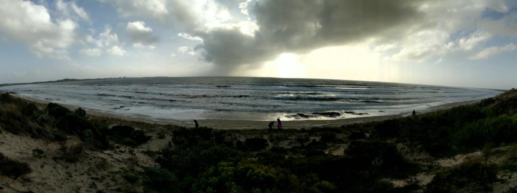 panoramic view of beach with clouds